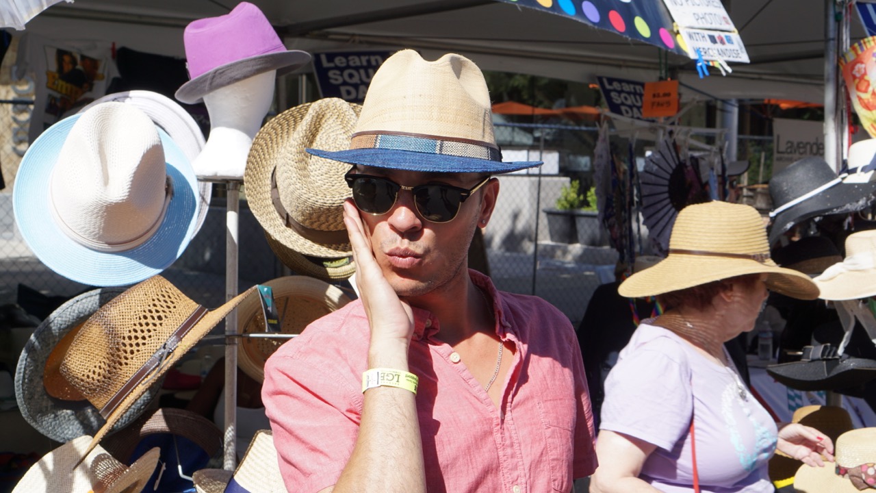 Anthoy Trying on a Hat at Sacramento Pride 2017